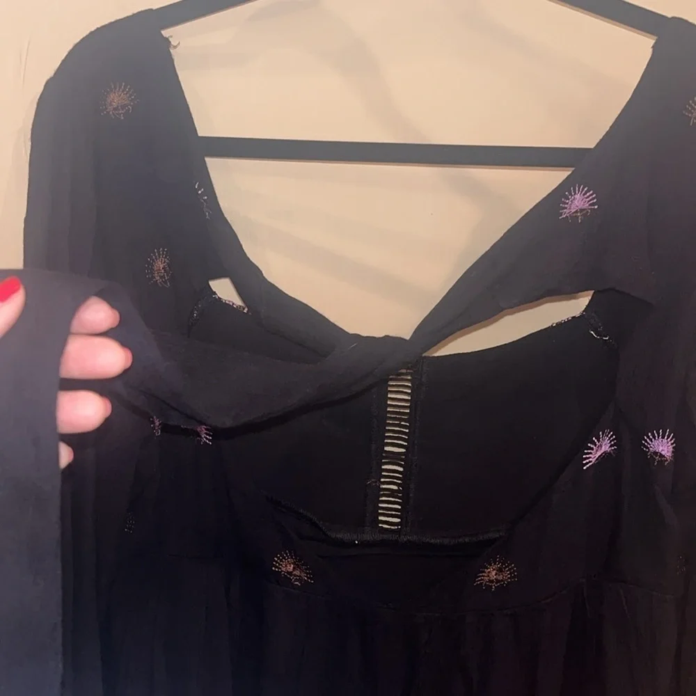 Free People black mini dress size XS with back tie and deep V bk w/ embroidery